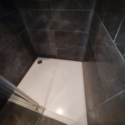 Cracked shower Tray.Masking removed. Job complete